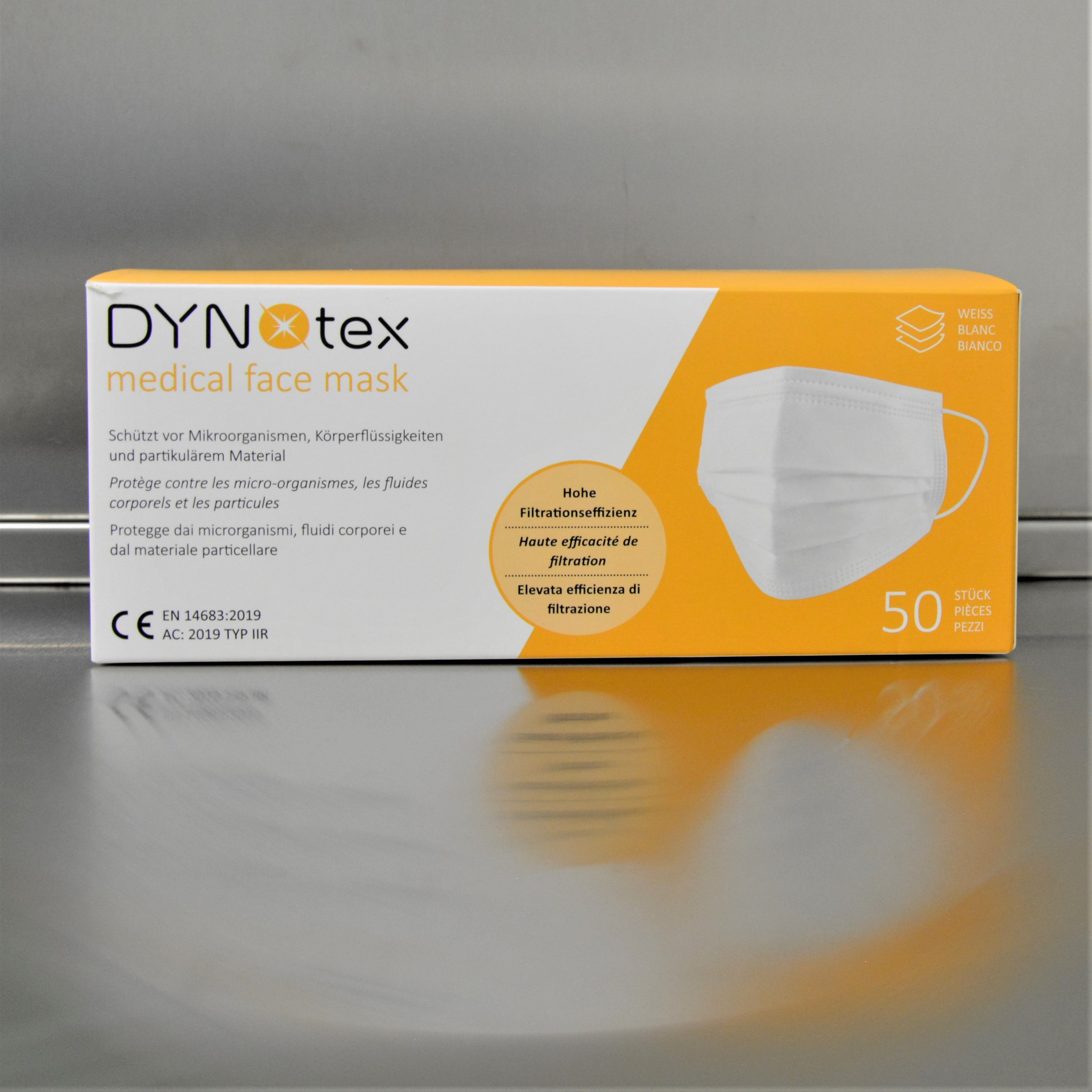 DYNOtex faceMask ear-18Masken verpackt in einer orange-weissen Schachtel.
